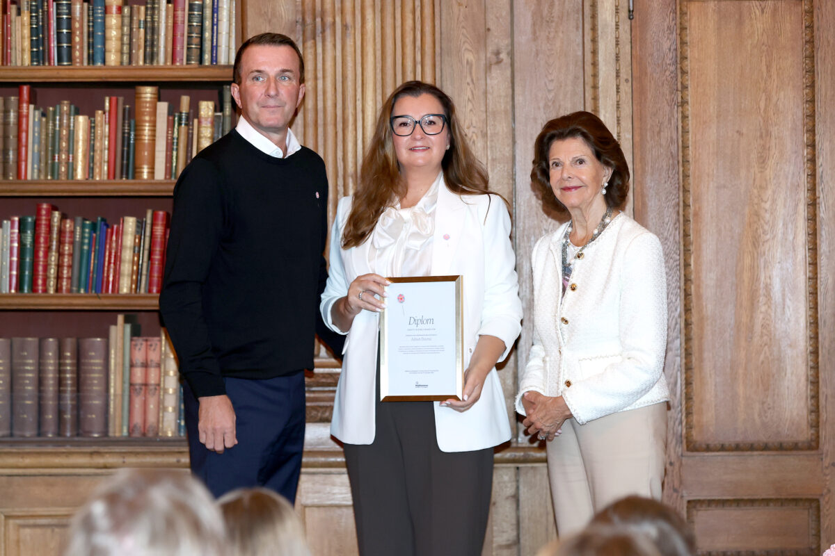 Familjen Deumic och H.M. Drottningen
